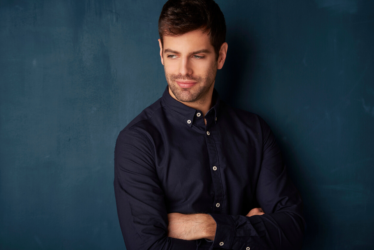 man in dark colored button down shirt